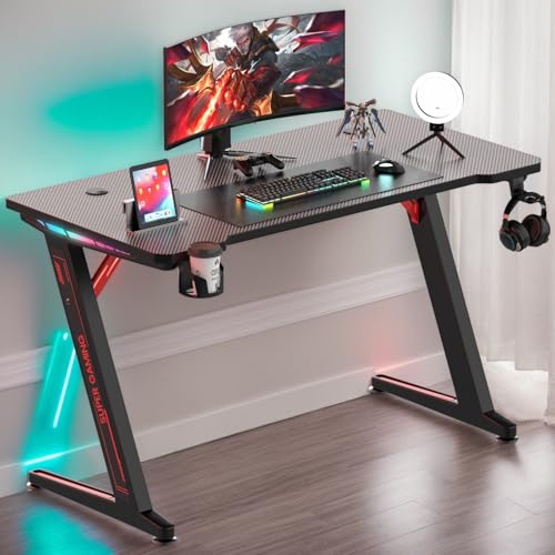 Gaming Schreibtisch mit Led 120x60cm，Z-Frame Gaming Tisch mit Kohlefaserbeschichtung，Getränkehalter，Kopfhörer Haken，Computertisch PC，Stabiler Gamer Tisch Ergonomischer für Home Office，Arbeitstisch